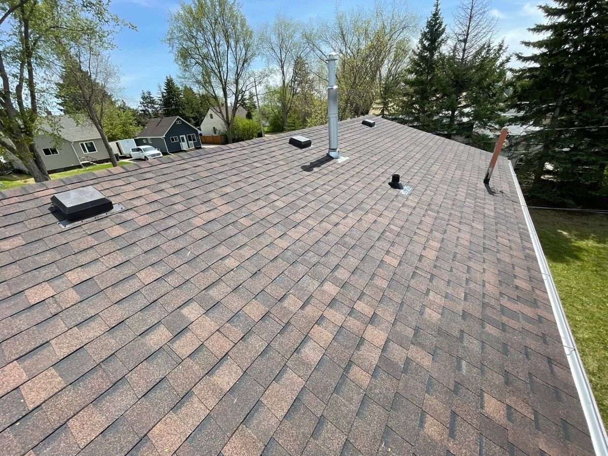 Completed warm brown shingle roof near Sheho Saskatchewan
